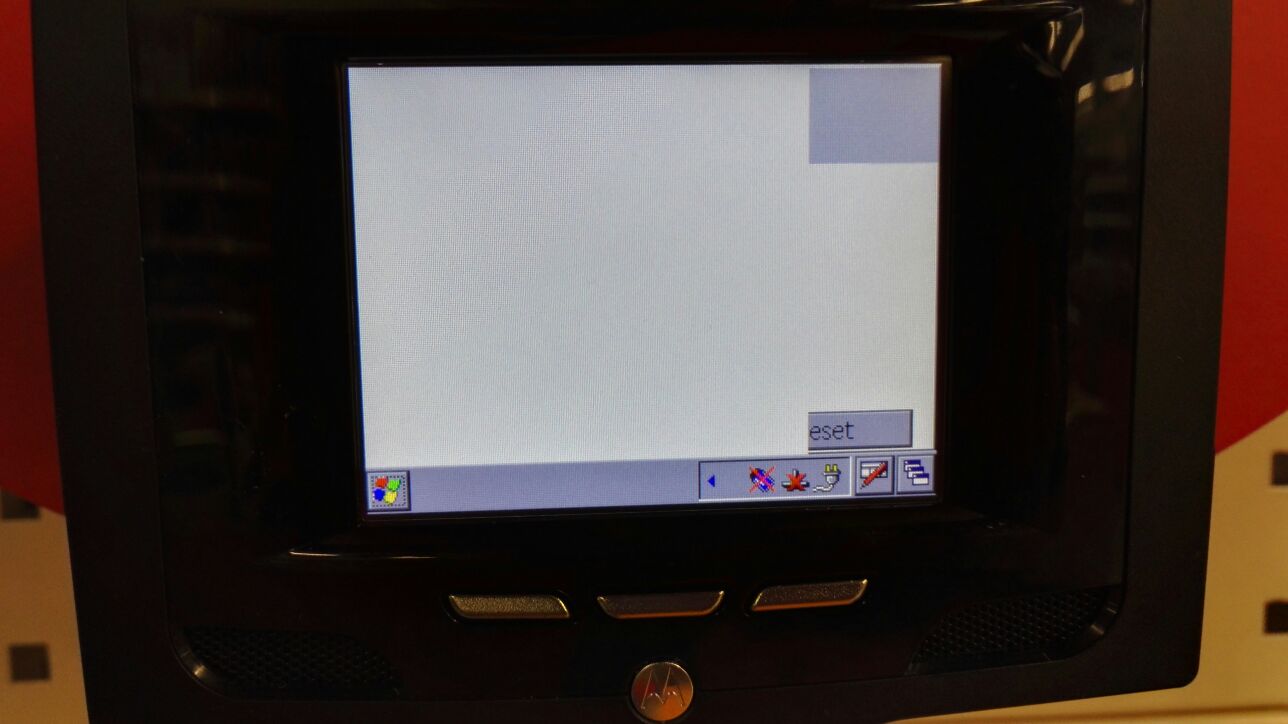 Windows CE based point of sale device displaying a cut-off button, remains of which read "eset"